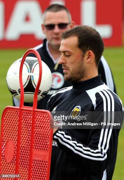 Scotland player Steven Fletcher is watched by manager Craig Levein during the training session at Mar Hall, Bishopton.