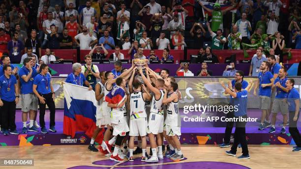 Slovenia's players celebrate with their trophy after defeating Serbia at the end of the FIBA Eurobasket 2017 men's Final basketball match between...