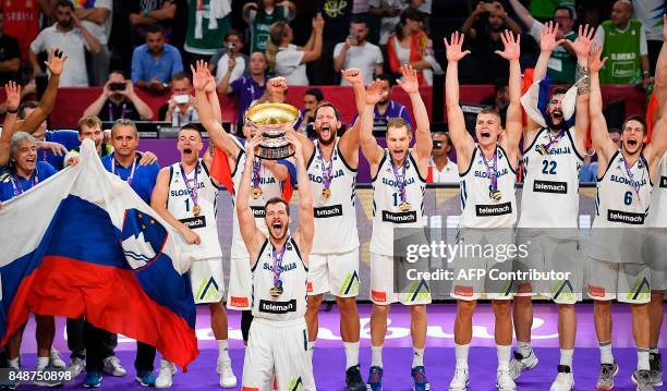 Slovenia's players celebrate with their trophy after defeating Serbia at the end of the FIBA Eurobasket 2017 men's Final basketball match between...