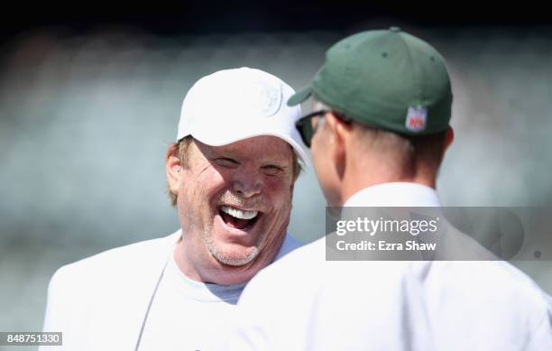 Oakland Raiders owner Mark Davis talks to Christopher Wold Johnson, the brother of the New York Jets owner Woody Johnson and the head of day-to-day...