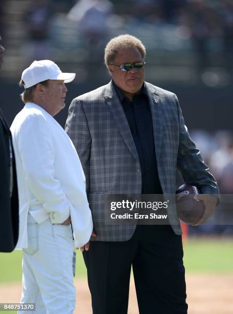 Oakland Raiders general manager Reggie McKenzie talks to Oakland Raiders owner Mark Davis before their game against the New York Jets at...