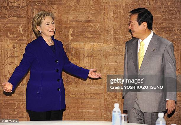 Visiting US Secretary of State Hillary Clinton shares a smile with Japan's main opposition Democratic Party of Japan leader, Ichiro Ozawa, prior to...