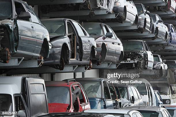 Wrecked and disused cars stand on shelves in a giant hangar at Berk car salvage on February 18, 2009 in Berlin, Germany. The German government has...