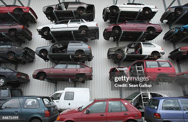 Wrecked and disused cars stand on shelves in a giant hangar at Berk car salvage on February 18, 2009 in Berlin, Germany. The German government has...