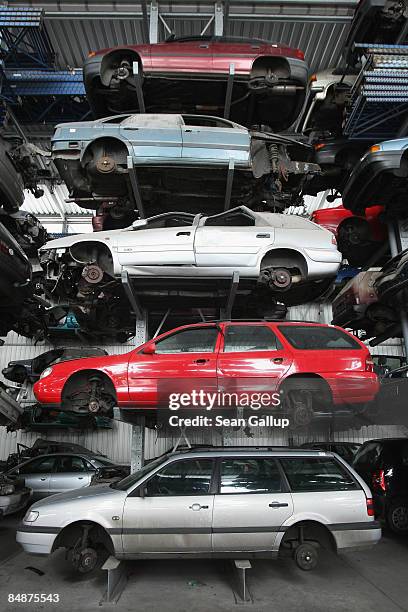 Wrecked and disused cars stand on shelves in a giant hangar at Berk car salvage on February 18, 2009 in Berlin, Germany. The German government has...