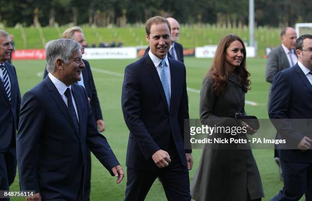 The Duke and Duchess of Cambridge are given a tour of St George's Park by FA chairman David Bernstein during the official launch of The Football...