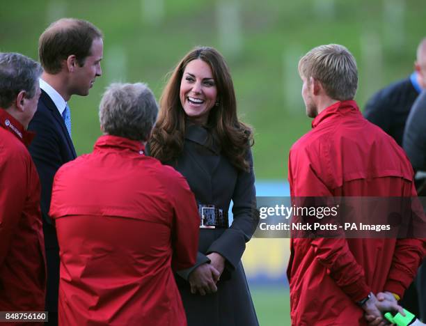 The Duke and Duchess of Cambridge meet the England coaching staff after the training session during the official launch of The Football Association's...