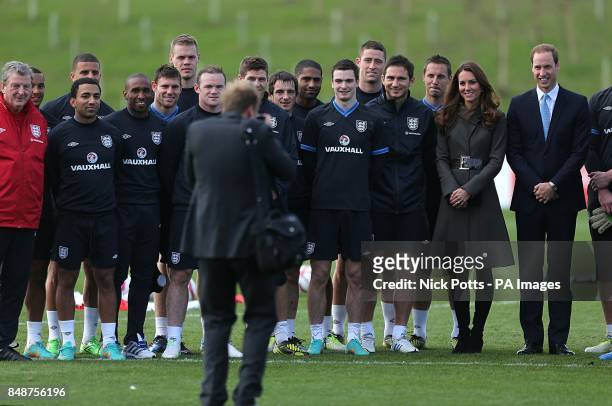 The Duke and Duchess of Cambridge pose for a photograph with the England squad during the official launch of The Football Association's National...