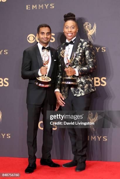 Aziz Ansari and Lena Waithe pose with the award for Outstanding Writing for a Comedy Series for 'Master of None' during the 69th Annual Primetime...