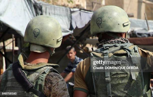 Picture taken during a press tour provided by the Russian Armed Forces on September 15, 2017 shows Russian soldiers standing guard in a central...