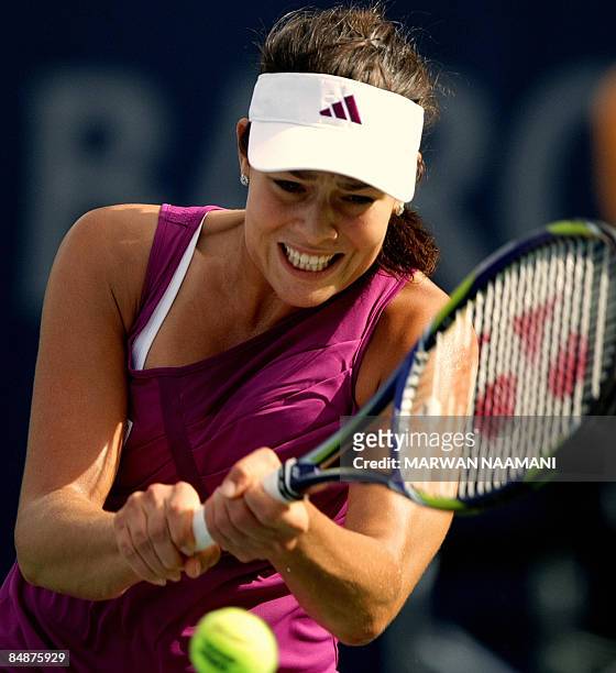 Serbia's Ana Ivanovic returns the ball to France's Camille Pin during their singles tennis match on the fourth day of the WTA Dubai Tennis...
