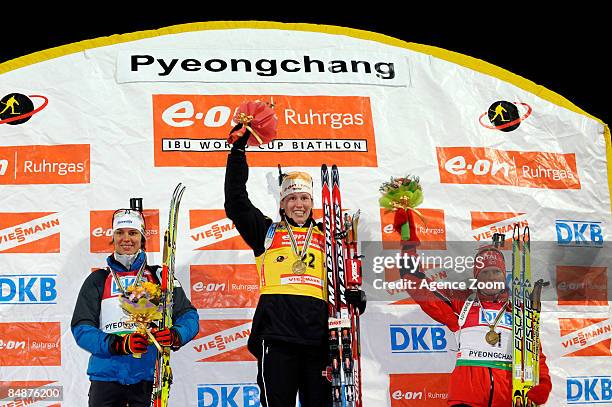 Teja Gregorin of Slovenia takes 2nd place, Kati Wilhelm of Germany takes 1st place and Tora Berger of Norway takes 3rd place during the IBU Biathlon...