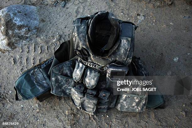 Bullet-proof vest belonging to a US soldier lies on the ground at Forward Operating Base Tagab-Kuschback near Tagab city in Afghanistan's Kapisa...