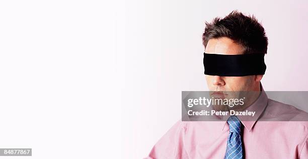 blindfolded businessman - blind fold stock pictures, royalty-free photos & images