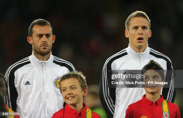 Scotland's Christophe Berra and Steven Fletcher before kick off