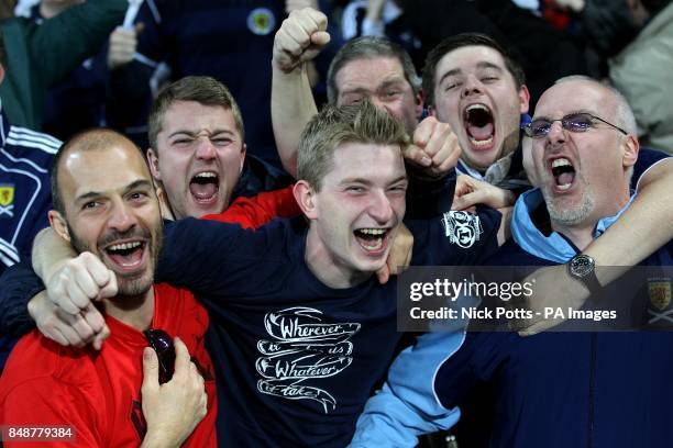 Scotland fans celebrate after James Morrison scores their first goal of the game