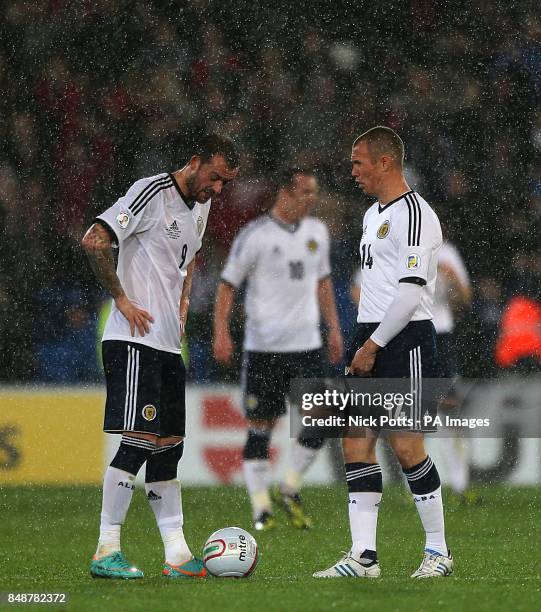 Scotland's Kenny Miller and Steven Fletcher dejected at the kick off after Wales score