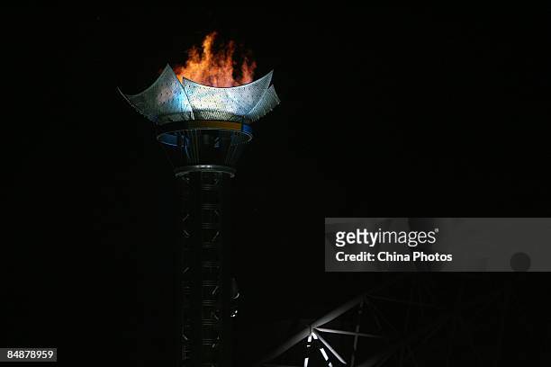 Fire burns in the cauldron during the opening ceremony of Harbin 24th Winter Universiade 2009 on February 18, 2009 in Harbin of Heilongjiang...