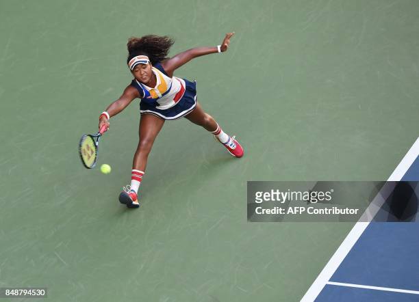 Naomi Osaka of Japan returns a shot to Angelique Kerber of Germany during the first round match of the Pan Pacific Open tennis tournament in Tokyo. /...