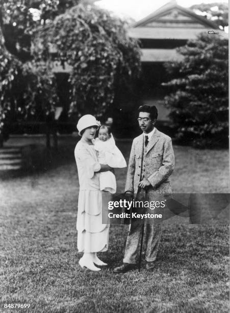 Emperor Hirohito of Japan with his baby daughter Princess Shigeko and Crown Princess Nagako, December 1925.