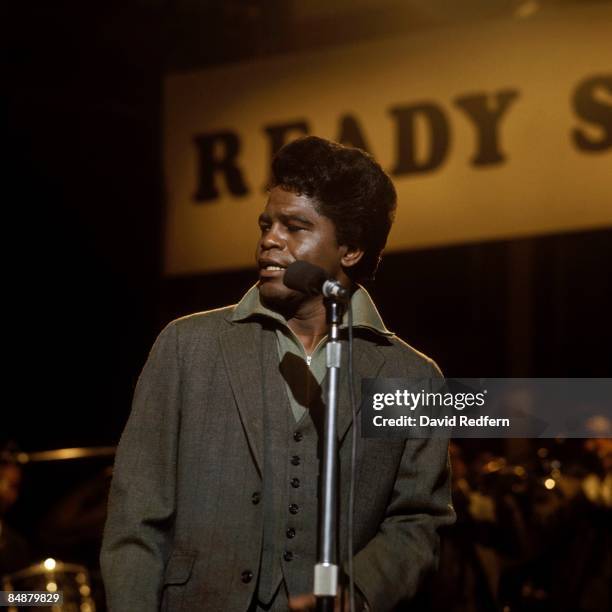 American soul singer and songwriter James Brown performs live on stage with The Famous Flames on the set of the Associated Rediffusion Television pop...