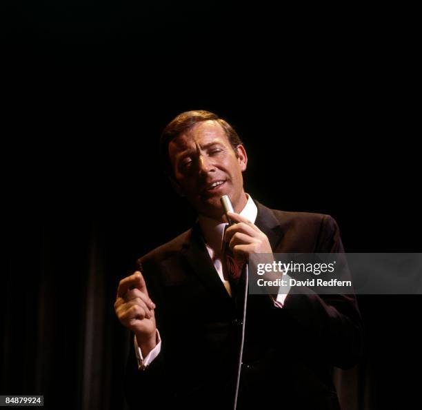 Irish singer Val Doonican performs on a BBC television show at Television Centre, London circa 1965.