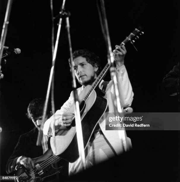 American singer, songwriter and musician Bob Dylan performs live on stage with Rick Danko of the Band at the 1969 Isle of Wight Festival at Woodside...