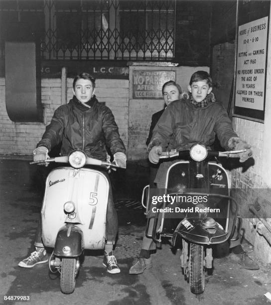 Group of mods posing on their scooters outside The Scene club in Soho, London, circa 1964.