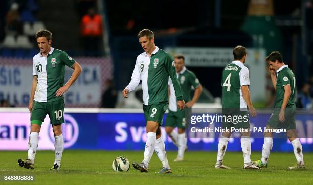 Wales' Steve Morison and Andy King look dejected after conceeding a second goal