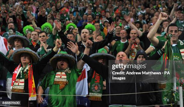 Northern Ireland fans celebrate in the stands during the World Cup Group F Qualifying match at the Estadio do Dragao, Porto, Portugal.