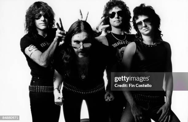 Photo of LEMMY and MOTORHEAD posed in a studio in London in July 1984. Left to Right: Mick "Wurzel" Burston, Lemmy Kilmister, Pete Gill and Phil...