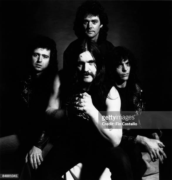 Photo of LEMMY and MOTORHEAD posed in London in July 1984. Clockwise from top: Pete Gill, Mick "Wurzel" Burston, Lemmy Kilmister, Phil Campbell.