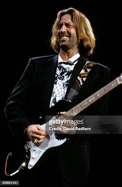 English guitarist Eric Clapton performs live on stage playing his 'Blackie' Fender Stratocaster guitar at the Royal Albert Hall in London in January...