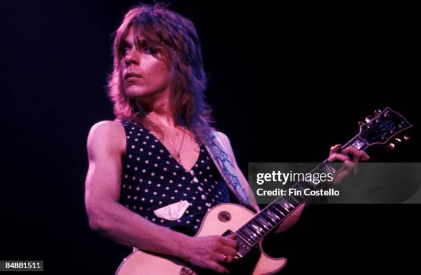 Photo of Randy RHOADS; playing Gibson Les Paul guitar, performing live onstage with Ozzy Osbourne