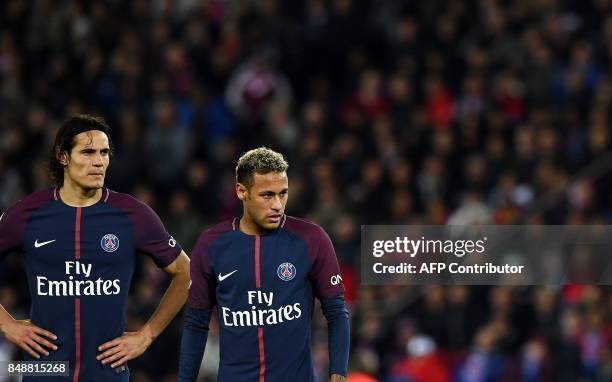 Paris Saint-Germain's Uruguayan forward Edinson Cavani and Paris Saint-Germain's Brazilian forward Neymar react during the French Ligue 1 football...