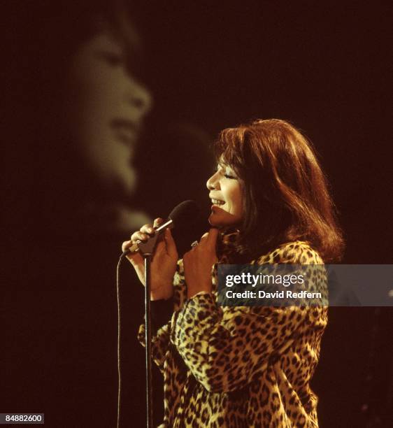 French singer and actress Juliette Greco, wearing a leopard print coat, performs on a television show circa 1973.