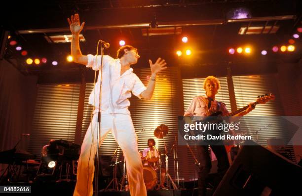 Photo of Bryan FERRY and ROXY MUSIC; Bryan Ferry & Gary Tibbs performing live onstage on Flesh & Blood tour,