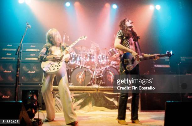 Photo of Geddy LEE and Alex LIFESON and RUSH, L-R: Alex Lifeson, Neil Peart, Geddy Lee - performing live onstage on All The World's A Stage tour