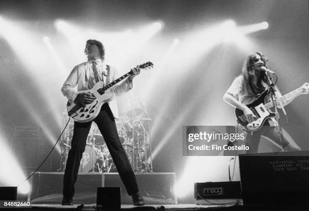 Photo of Alex LIFESON and RUSH; L-R: Alex Lifeson, Geddy Lee performing live onstage on Permanent Waves tour