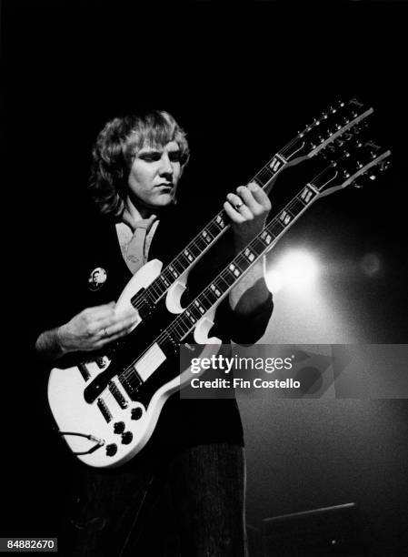 Photo of Alex LIFESON and RUSH; Alex Lifeson performing live onstage, playing Gibson ES-1275 double neck guitar on Permanent Waves tour