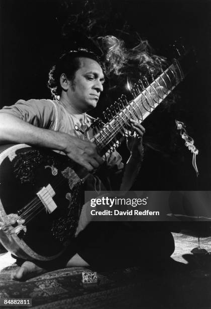 Indian musician Ravi Shankar plays a sitar on a television show circa 1965.