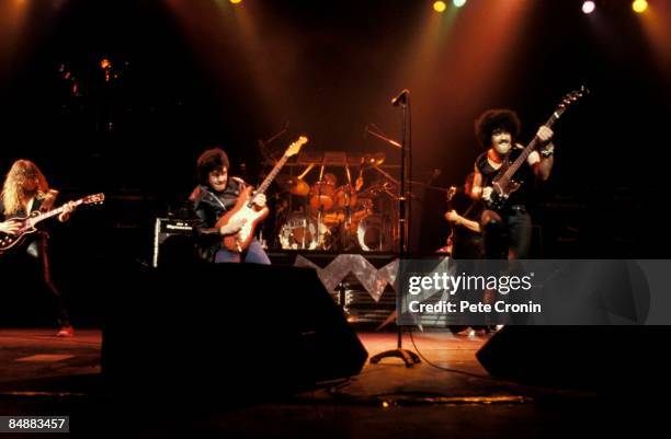 Photo of Brian DOWNEY and Gary MOORE and THIN LIZZY and John SYKES and Phil LYNOTT; L-R: John Sykes, Gary Moore, Brian Downey, Phil Lynott performing...