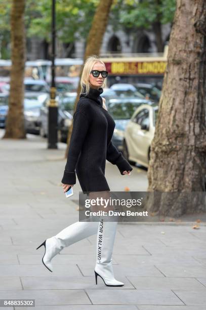 Tatiana Korsakova seen wearing a Monse dress, boots by Off-White, Repossi jewelry and REVE sunglasses on Day 3 of London Fashion Week September 2017...