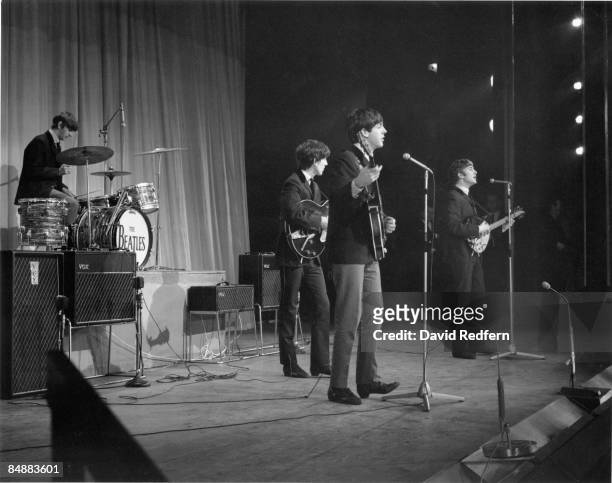English rock and pop group The Beatles, from left, Ringo Starr, George Harrison , Paul McCartney and John Lennon perform on stage during rehearsals...