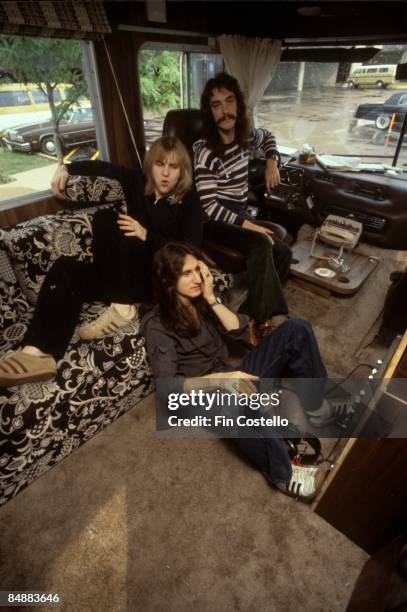 Photo of TOUR BUS and RUSH, Alex Lifeson, Geddy Lee , Neil Peart - posed, group shot, on tour bus on All The World's A Stage tour