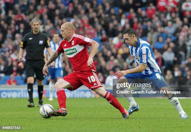 Middlesbrough's Nicky Bailey takes on Brighton's Andrew Crofts during the Npower Championship match at the AMEX Stadium, Brighton.