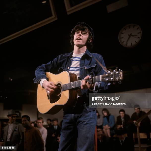 Scottish singer and musician Donovan, playing a Martin acoustic guitar, performs on the music television series Ready Steady Go! at Kingsway studios...