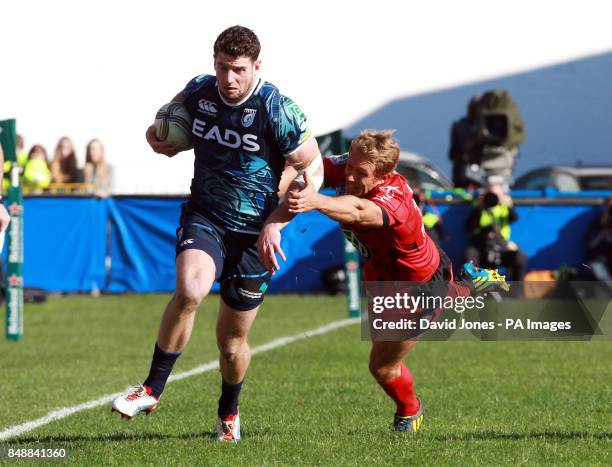 Cardiff Blues' Alex Cuthbert evades Toulon's Jonny Wilkinson during the Heineken Cup match at Cardiff Arms Park, Cardiff.