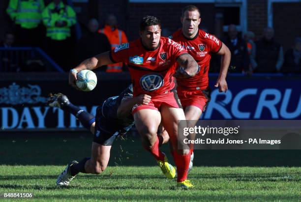 Toulon's David Smith is tackled by Cardiff Blues' Jamie Roberts during the Heineken Cup match at Cardiff Arms Park, Cardiff.