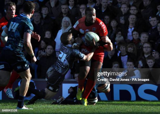 Toulon's Mathieu Bastareaud is tackled by Cardiff Blues' Lewis Jones during the Heineken Cup match at Cardiff Arms Park, Cardiff.